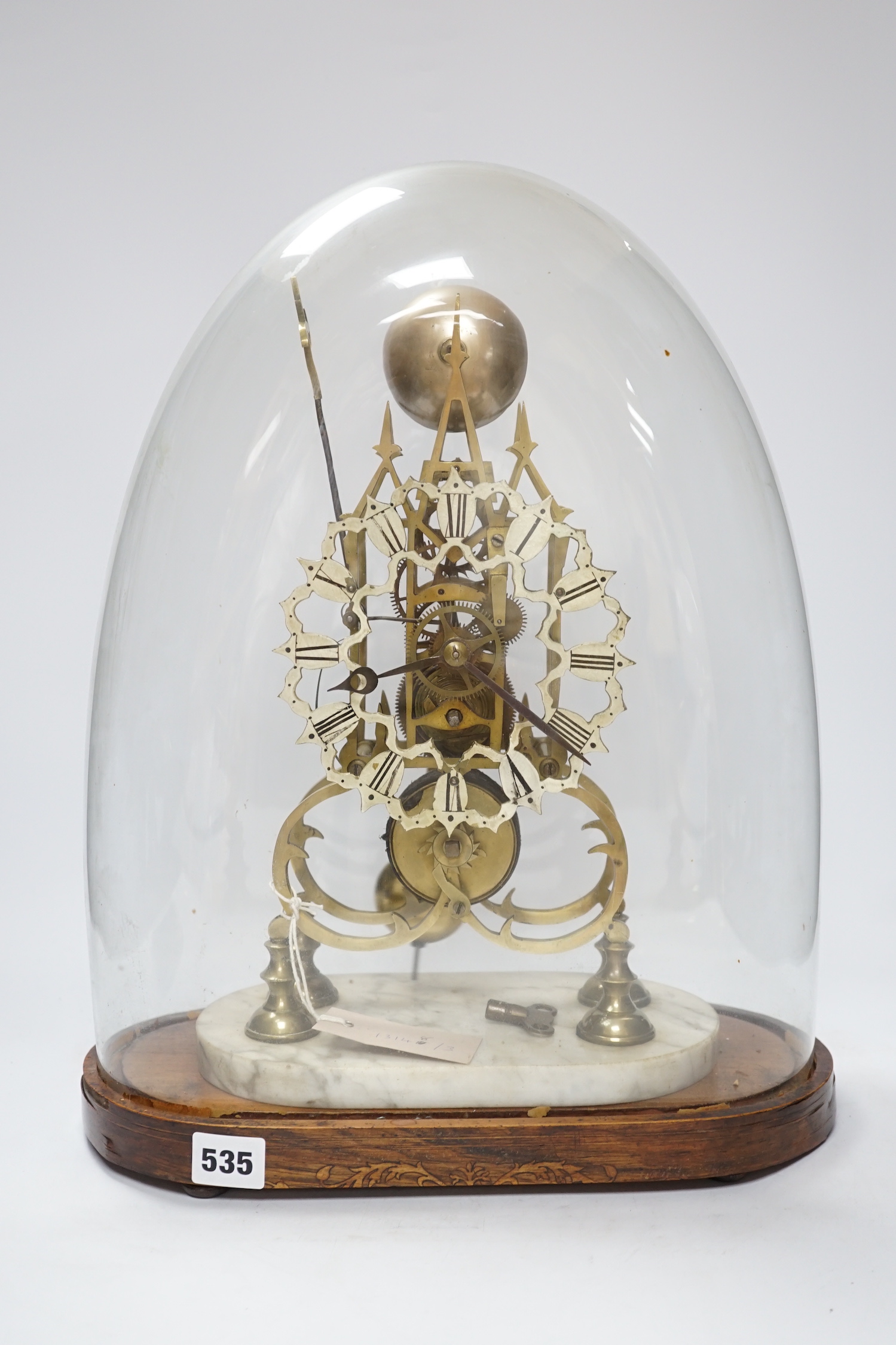 A late 19th century skeleton clock, under glass dome, 44cm high